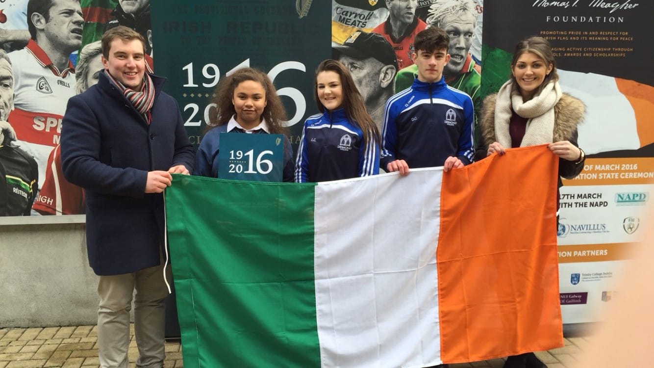 March 2016: Mr Kelly and Ms Hennessy with students Latina Massey, Laoise Curtin and Darragh Collins collecting The Flag at the 1916 Commemoration Service in Croke Park
